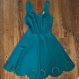 ModCloth green dress with peplum, cutout bottom